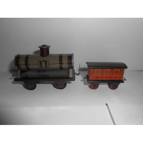 366 - Fifteen items of tin plate rolling stock and a clockwork engine