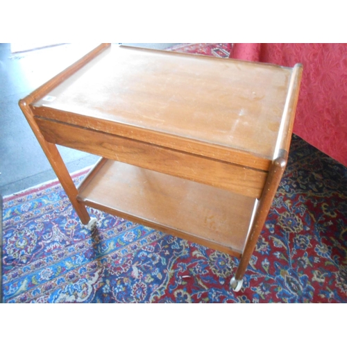 37 - A teak two tier tea trolley fitted drawer - 27in. wide