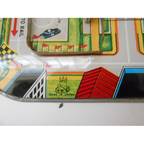 373 - A German WV tin plate clockwork bus station toy - 9 1/2in. wide and a Japanese TPS friction tin plat... 