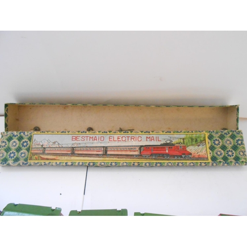 377 - A tin plate clockwork Magic Railway, boxed and a Bestmaid Electric Railway, boxed