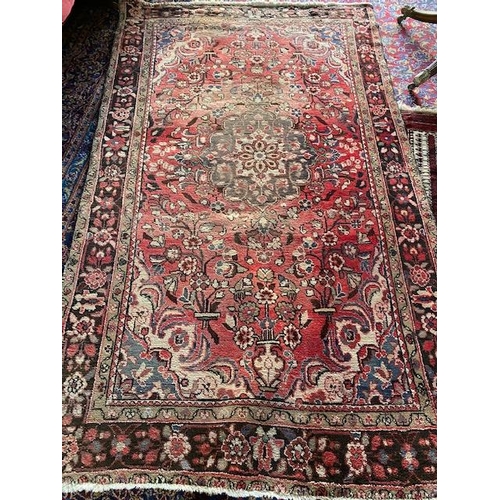 6 - An Eastern rug, red field with twenty four medallions, fringed - 110in. x 42in. and one other Easter... 