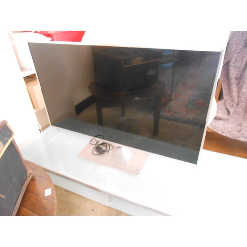 68 - A Panasonic 47in. flatscreen television on two tier glass and metal stand with castors