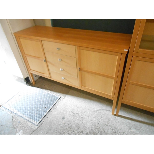 69 - A light oak effect cabinet fitted two glass doors above two panelled doors, on tapering legs - 36in.... 