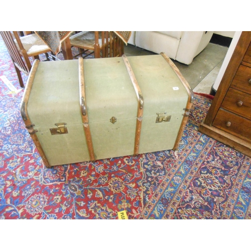 91 - A large green canvas and wood bound cabin trunk