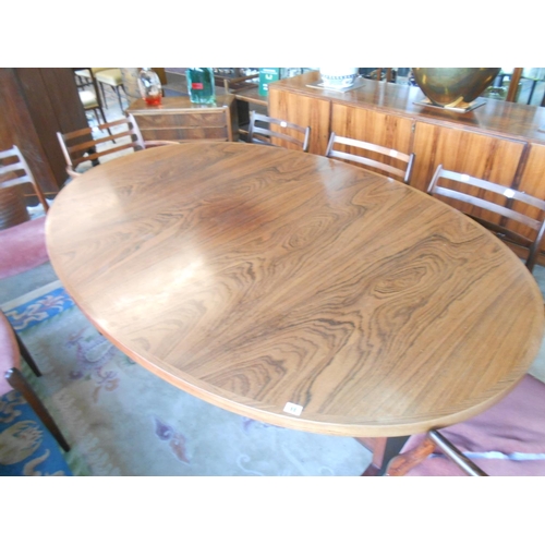 98 - A Danish rosewood dining room suite comprising:- Skovby  Furniture Factory dining table with two ext... 