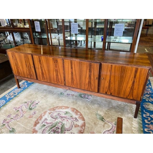 98 - A Danish rosewood dining room suite comprising:- Skovby  Furniture Factory dining table with two ext... 