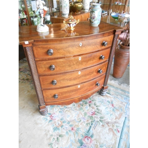 39 - A Georgian mahogany, satinwood inlaid and crossbanded bow front chest with half fluted pilasters, fi... 