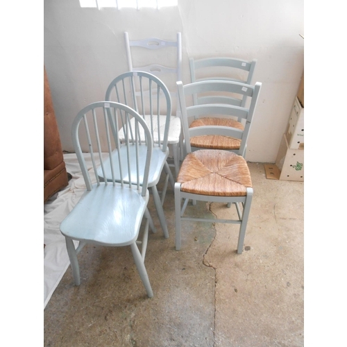 51 - An oak carver chair with ladder back, rush seat and turned legs, two blue painted chairs with rush s... 