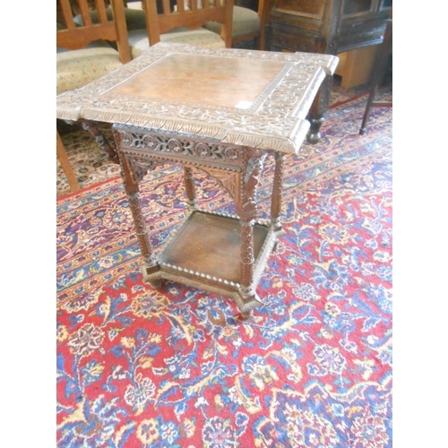 57 - An Indian occasional table with square top, outset corners, on turned legs and undertier - 20in. squ... 