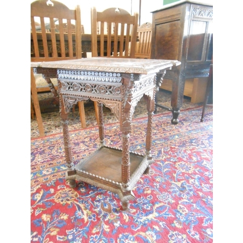 57 - An Indian occasional table with square top, outset corners, on turned legs and undertier - 20in. squ... 