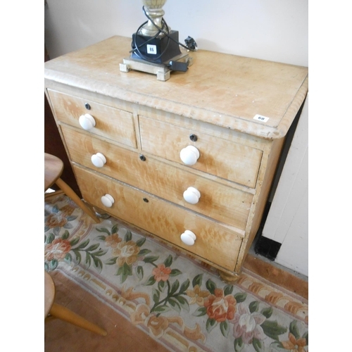 60 - A pine straight front chest fitted two narrow and two wide drawers, white pot handles, on turned fee... 