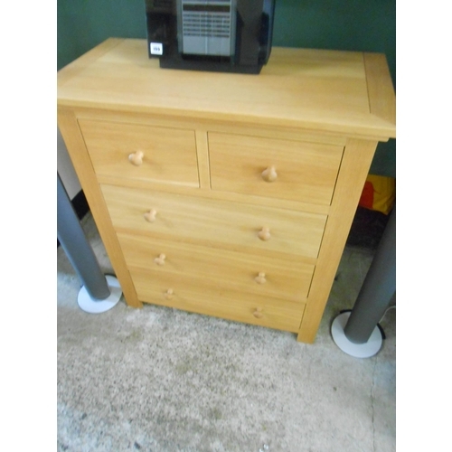 74 - A modern light oak chest fitted two narrow and three wide drawers - 34 1/2in. wide and a similar bed... 