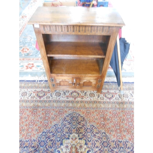 77 - An oak openfront bookcase fitted four shelves, on splayed legs - 32 1/2in. wide and a reproduction o... 