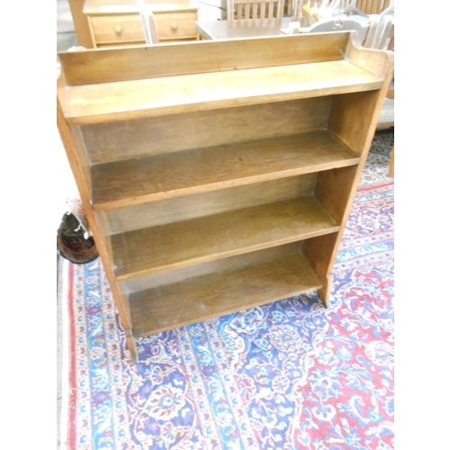 77 - An oak openfront bookcase fitted four shelves, on splayed legs - 32 1/2in. wide and a reproduction o... 