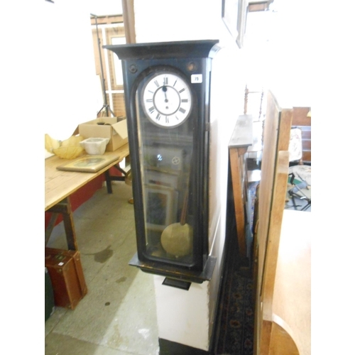 79 - A regulator wall clock with white enamel dial, seconds dial, in an ebonised and glass case