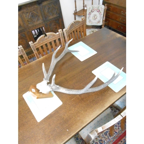 93 - A set of deer antlers mounted on a wooden shield