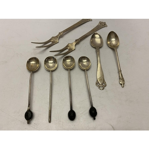 166 - A pair of Norwegian silver cake forks, a Norwegian silver teaspoon, four silver coffee spoons and a ... 