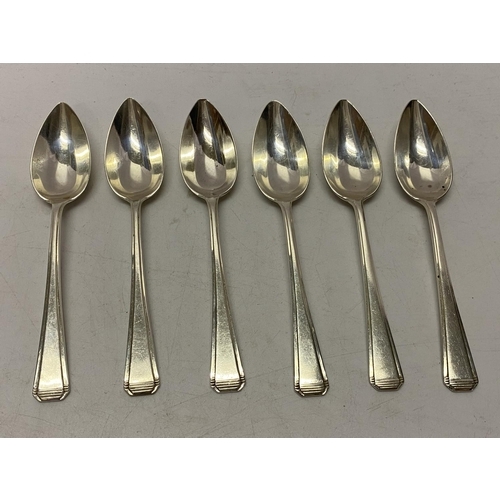 176 - A set of six silver grapefruit spoons - London 1935, makers marks for Harrods Ltd