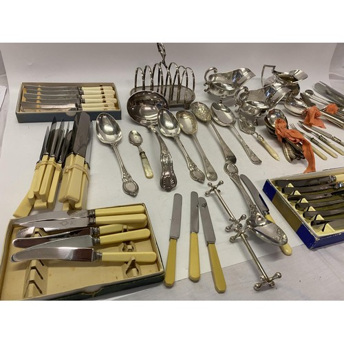 184 - A selection of silver plated items including toastrack, soup ladle, double handled cream jug and sug... 