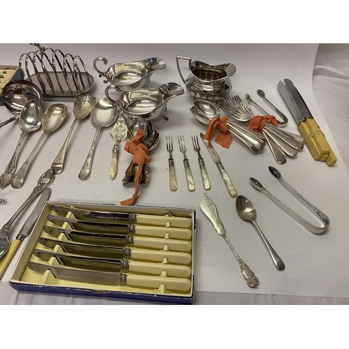 184 - A selection of silver plated items including toastrack, soup ladle, double handled cream jug and sug... 