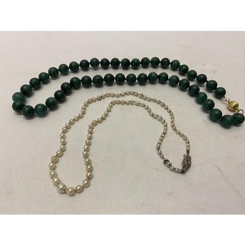 211 - A row of graduated pearls with silver and pearl set clasp and a row of malachite beads with 18ct. go... 