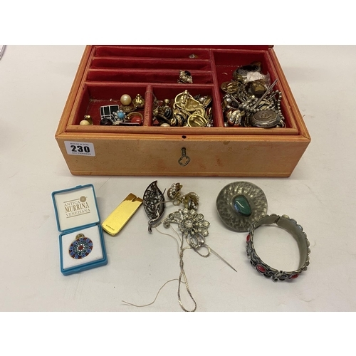 230 - A red leather jewellery box containing a quantity of dress earrings, necklaces, articulated fish pen... 