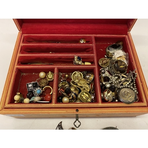 230 - A red leather jewellery box containing a quantity of dress earrings, necklaces, articulated fish pen... 