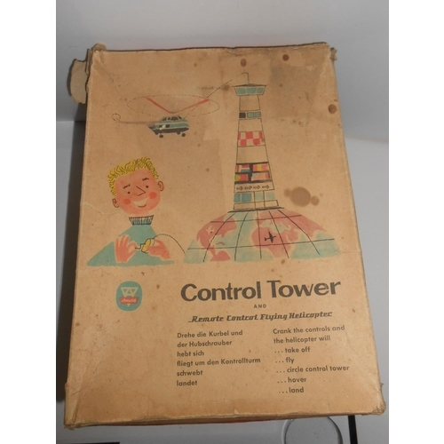 354 - An Arnold Control Tower And Remote Control Flying Helicopter, boxed