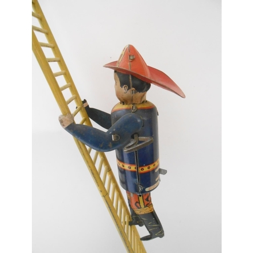 383 - A Marx Toys tin plate model of  The Climbing Fireman with ladder - 21in. high