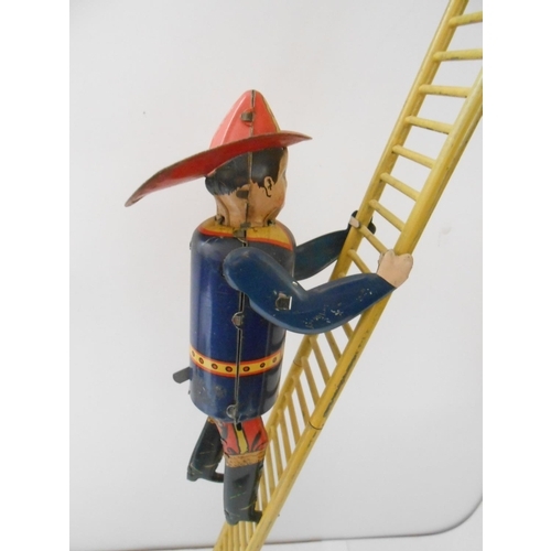 383 - A Marx Toys tin plate model of  The Climbing Fireman with ladder - 21in. high