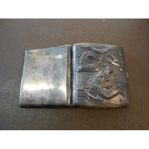 194 - A silver coloured metal cigarette case, the front inset with hammered silver coloured metal panel de... 