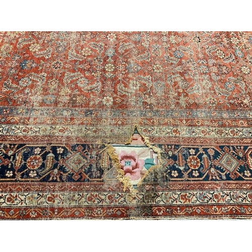 1 - A large Feraghan carpet (damaged)