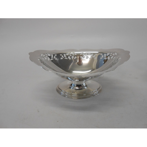 138 - A pair of silver navette shaped sweetmeat dishes with pierced borders, on pedestal and oval foot - S... 