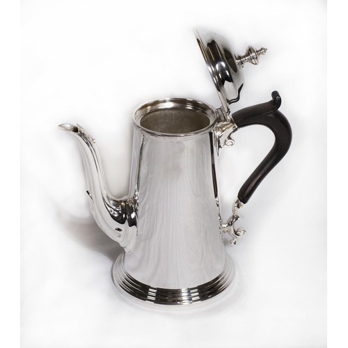 143 - An 18th Century style silver coffee pot of tapering circular form, ebony handle - Sheffield 1931, ma... 