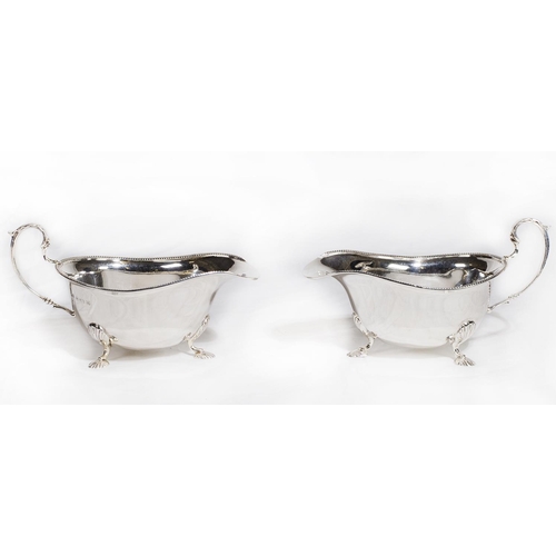 148 - A pair of silver sauce boats on pad feet - Birmingham 1936, makers marks for Duncan and Scobbie