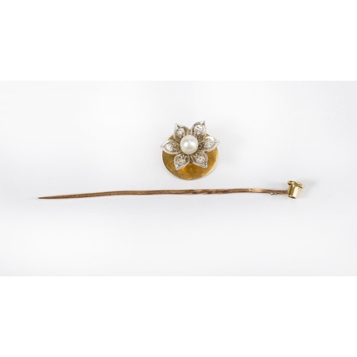 193 - A Victorian 15ct. gold stud of flower form set centre pearl with diamond set petals, converting to a... 