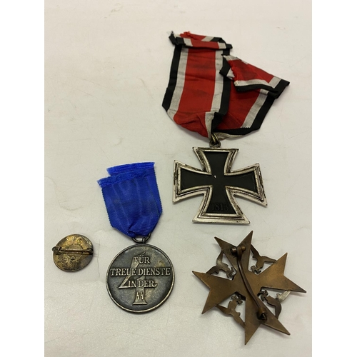 255 - Four Second World War German style medals and badges