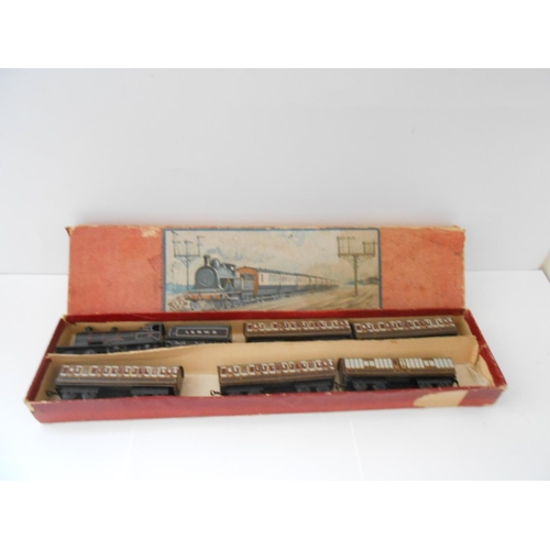 350 - A miniature tin plate railway in fitted box