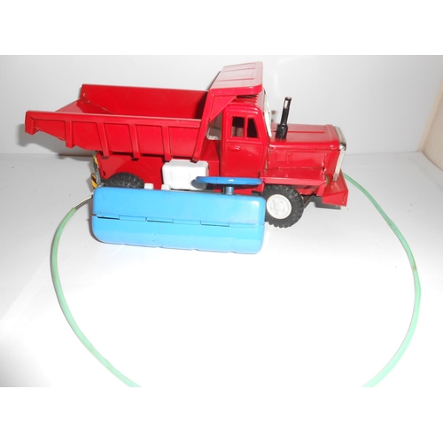 356 - A Japanese battery operated remote control Dump Truck With Flashing Lights, boxed - 10in. long