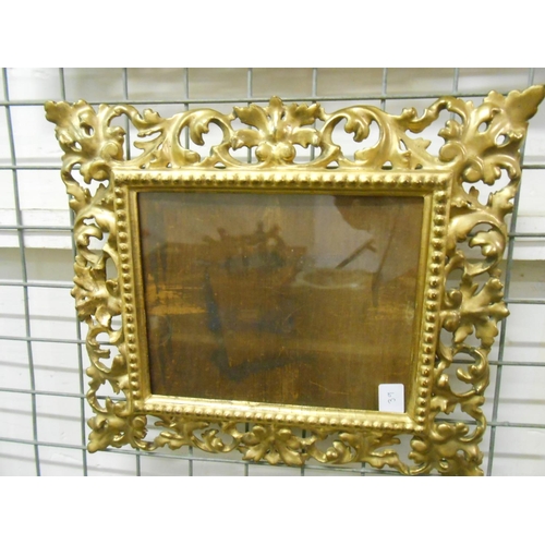 39 - An oak picture frame with carved decoration - 31in. x 20in. and a small carved gilt wood Florentine ... 