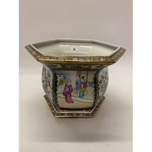 91 - A modern Cantonese style jardiniere and a selection of decorative items including winged figures, te... 