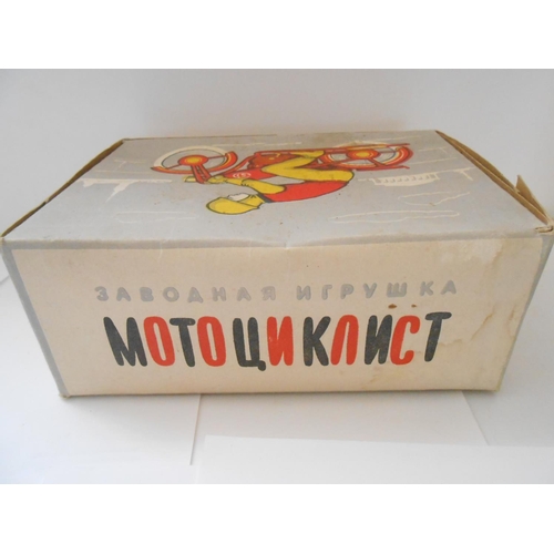 372 - A USSR clockwork tin plate motorcycle and rider, boxed - 8 1/2in. long and 6 1/2in. high