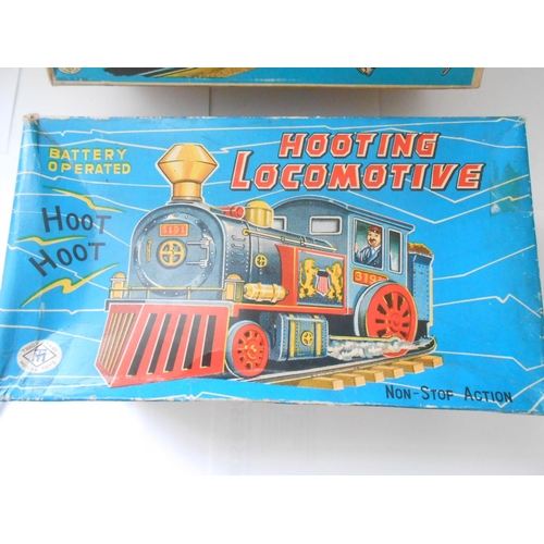 373 - A Japanese Modern Toys battery operated Eastern Pioneer, boxed and a Hooting Locomotive, boxed - bot... 