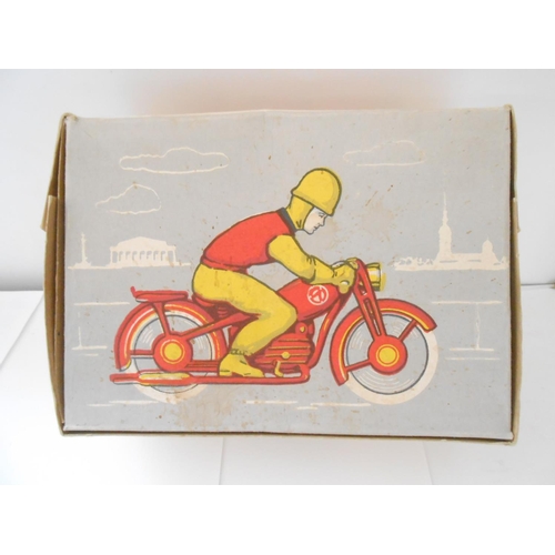 372 - A USSR clockwork tin plate motorcycle and rider, boxed - 8 1/2in. long and 6 1/2in. high