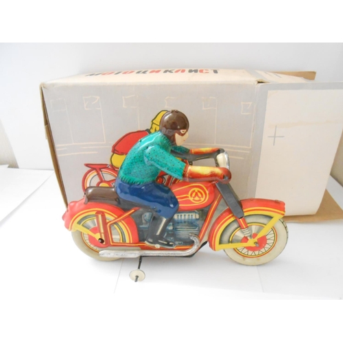 372 - A USSR clockwork tin plate motorcycle and rider, boxed - 8 1/2in. long and 6 1/2in. high