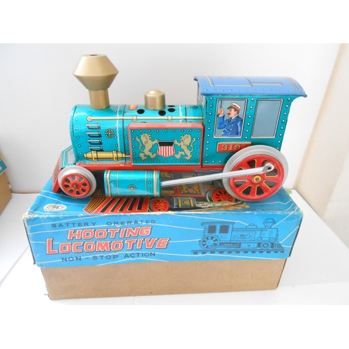 373 - A Japanese Modern Toys battery operated Eastern Pioneer, boxed and a Hooting Locomotive, boxed - bot... 