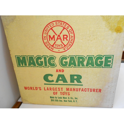 375 - A Louis Marx Magic Garage and Car, boxed - 10 1/2in. long and 8 1/2in. high