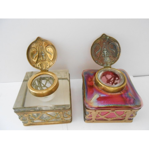 380 - A square glass inkwell with pierced gilded metal frame with flower and swag decoration and a similar... 