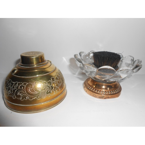 383 - A brass inkwell with engraved decoration of flowers, a plain brass covered inkwell, a white glazed p... 