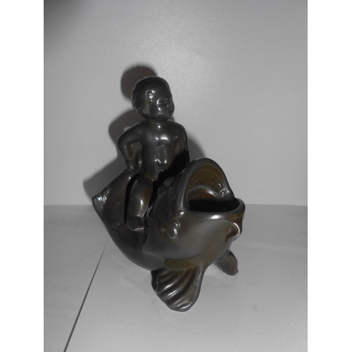 389 - A bronze inkwell in the form of a fish and cupid - 3 3/4in. high, a black pottery inkwell in the for... 